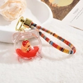 Capybara keychain with red liquid sand in bear shell and colorful braided rope - Capybara Quicksand (Lanyard Style) / Alarm Clock