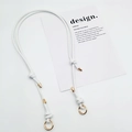 Detail of adjustable white leather bag strap with gold spring clips and knot accents - Gold Ring Buckle / White