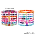 Set of 14 colorful bohemian heishi beaded bracelets with flower charms and gold beads - SY0104 (Set of 14/Smile Flower)
