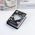 Detail of a black 3-inch photo album cover featuring a heart-shaped cutout and rainbow motif - Black Bear Heart