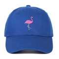 Close-up of pink flamingo embroidery and navy blue cotton twill on a baseball cap - Sapphire Blue