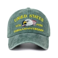Close-up of the eagle embroidery and 250th Anniversary text on a green baseball cap - Dark Green