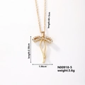 Detail shot of gold butterfly necklace with zircon settings and dimensions 2.58x1.96cm - N00918-5/Abstract Bowknot