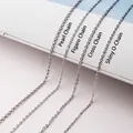 Detailed macro view of S925 sterling silver chain styles including pearl and cross link - Pearl-Style Link Chain / 45cm / White Gold