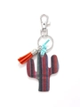 Wooden cactus keychain detail with colorful stripes and decorative orange tassel - Multicolor Striped Cactus/Orange Tassel