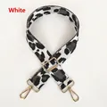 Detailed view of leopard print bag strap with golden metal hooks and adjustable buckle - White Dark Grey
