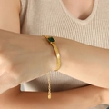 Gold flat snake chain bracelet with a rectangular emerald cut green gemstone for women - Green Zirconia Gold Bracelet (E377)