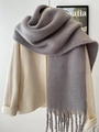 Winter mohair style grey solid color scarf with long tassel details on a beige coat - Gray