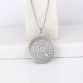 Silver round locket necklace with vintage floral engraving on white marble - Patterned Round/Steel