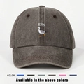 Detail of white Silly text and goose embroidery on washed dark gray cotton baseball cap - One Size / Coffee
