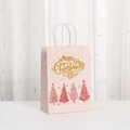 Bolsa de regalo de Navidad en papel rosa con texto dorado y diseños festivos de árboles - Árbol de Navidad rosa