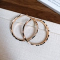 Detail view of gold hoop earrings featuring elegant black and white leopard print patterns - Silver Needle-Gold-Light Coffee