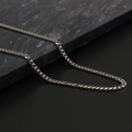 Polished silver stainless steel Cuban link necklace for men and women displayed on black marble - 4mm * 45cm