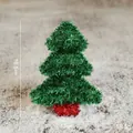 Mini green tinsel Christmas tree cone ornament on snow background, 16.5cm height - Green Christmas Tree