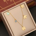 Gold multi-charm necklace with clover, swallow, heart, and evil eye on gold jewelry box - Evil Eye Clover Heart Bird Style (2#)