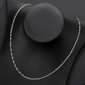 Close-up of a silver twisted curb chain necklace displayed on a black velvet bust - Steel Water Wave Chain / 45cm+5cm