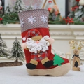 Detail of red Christmas stocking with 3D Santa Claus figure and snowflake knitting pattern - Large Santa Claus Christmas Stocking