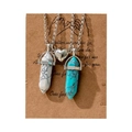 Detail of magnetic heart pendants and hexagonal crystal stone necklaces on card - White and Green Pair