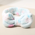 Light blue plush headband with pink star patterns and a large soft bow for face washing - Light Blue Strawberry