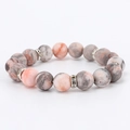Detailed close-up of 8mm pink zebra jasper beads with silver rhinestone spacers - 10MM Silver Spacers Matte Pink Zebra