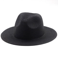 Close-up of black straw fedora hat showing fine weave texture and wide sunshade brim - Black