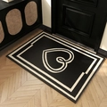 Black and white woven entrance doormat with heart pattern on modern wooden floor - 50x80cm / Black