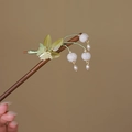 Detail of wooden hair pin with green leaves, white lily of the valley and pearl tassels - Tassel Lily (S413)