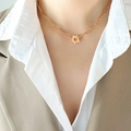 Rose gold paperclip chain necklace with plum blossom toggle clasp on model - Rose Gold Necklace