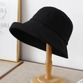 Minimalist black plaid sun hat with wide brim displayed on a wooden stand in natural light - Minimalist Textured Style / 12136 Black