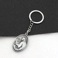 Vintage silver metal keychain with oval saint relief pendant for bags and cars - Retro Pewter