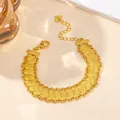 Detail of gold coin chain bracelet showing the lobster clasp and adjustable heart charm extension - Single Row Coin Bracelet