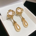 Detail of vintage heart earrings with champagne teardrop pearls in a white gift box - Gold
