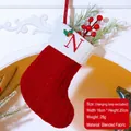 Red Christmas stocking with embroidered letter N and white cuff on fireplace decoration - Letter N / Red
