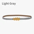 Adjustable light gray slim leather belt for women with elegant gold wavy buckle - Light Gray