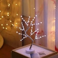 Modern LED cherry blossom tree lamp with white flowers and silver branches on a wooden table - 60L Snowflake Silver Branch White Light (Dual Use)