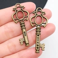 Set of two vintage bronze heart key pendants for creative DIY jewelry making projects - Antique Bronze Key 17x43mm