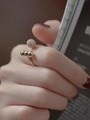 Minimalist open gold ring featuring one textured large bead and three small golden spheres - Gold Ball