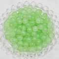 Detailed view of light green translucent 6mm glass beads for handmade jewelry DIY projects - 6mm / Light Green