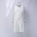 Detail of white V-neck vest and matching Bermuda shorts with pleats and white buttons - S / White