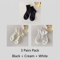 Three-pair pack of vertical ribbed cotton socks in black, cream, and white colors - Black+Cream+White