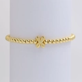 Minimalist 18k gold plated beaded bracelet with cross pendant on white display stand - Gold X