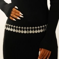 Detail of vintage silver boho coin belt with tassel relief patterns on a black dress - Vintage Coin Style (8915)