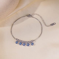 Bracciale in acciaio inossidabile argento con cinque ciondoli occhio blu su seta - Bracciale Argento