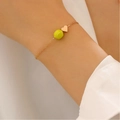 Bracelet tennis avec breloque cœur dorée et perle de sport vert néon vif - Bracelet tennis