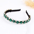 Elegant emerald green and clear crystal rhinestone headband with black fabric base - Green