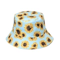 Detail of light blue bucket hat featuring all-over sunflower print and stitched brim - 58cm / Sky Blue
