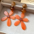 Detail view of orange resin flower earrings with brown beads on a velvet jewelry tray - Orange Resin Flower Style (21# Silver Earring Post - Brown)