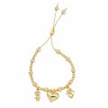 Dettaglio del bracciale a sfere dorate con chiusura a scorrimento e ciondoli pavé - Bambino+Cuore+Bambina / Oro