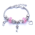 Silver bead bracelet with pink glass beads and floral heart pendants on snake chain - Pink