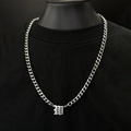 Silver Cuban link necklace with Gothic letter B pendant on black bust display - Silver Letter W